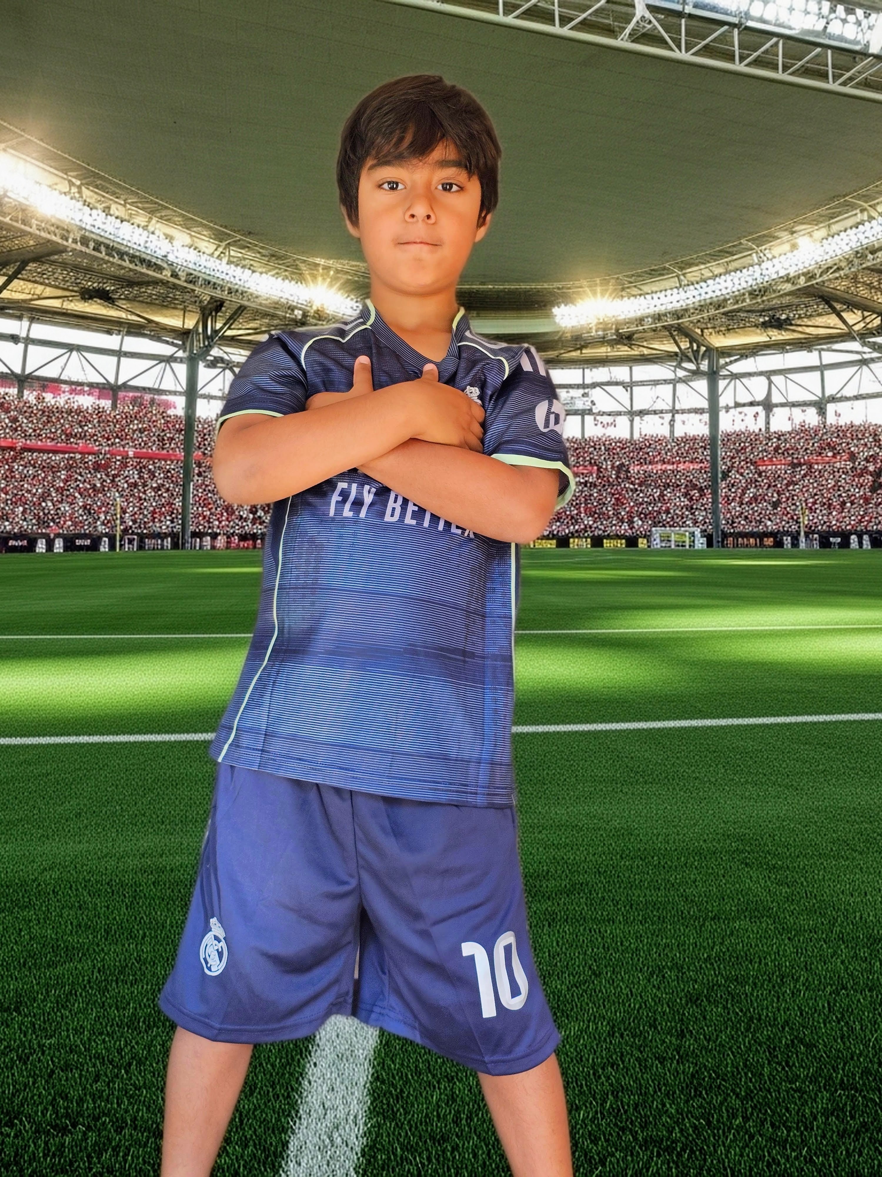 Sayyur Chagani wearing a soccer jersey in the stadium